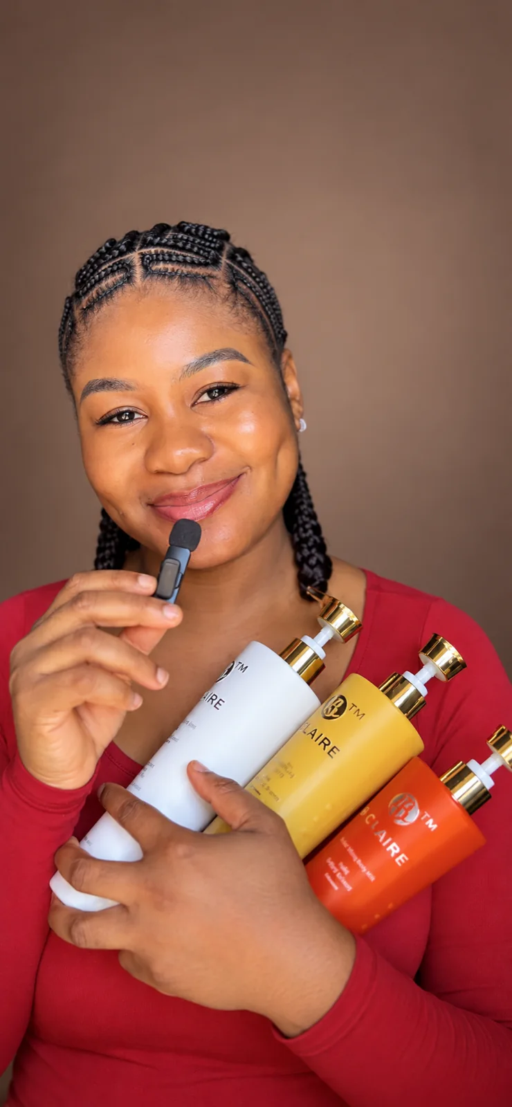 Cynthia holding a selection of skincare products